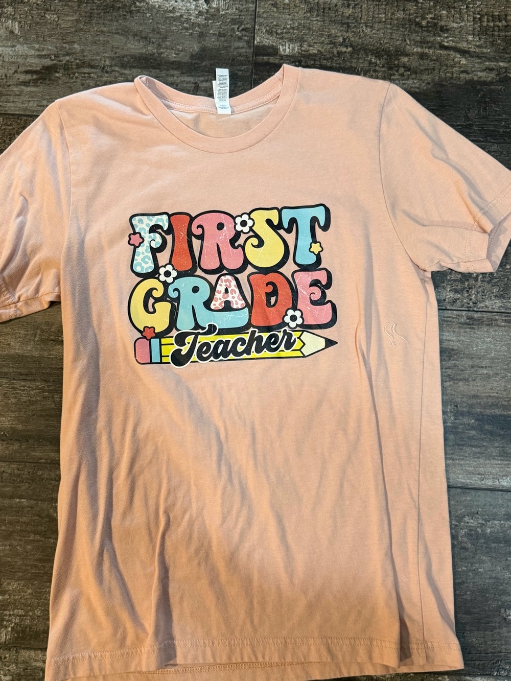 Bella Canvas Pink 'First Grade Teacher' Graphic Tee